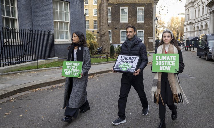 Campaigners handing in Oxfam's Make Rich Polluters Pay petition at 10 Downing Street, London.