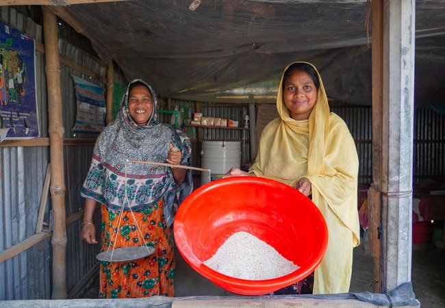 Alifa Begum and Lavly Akter at the store in Bangladesh where they sell fodder, supplements, and medicines for cows.