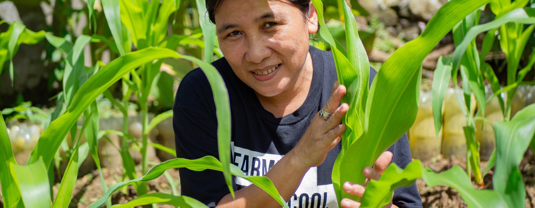 Lorna Antiola with her corn plants in the Philippines.