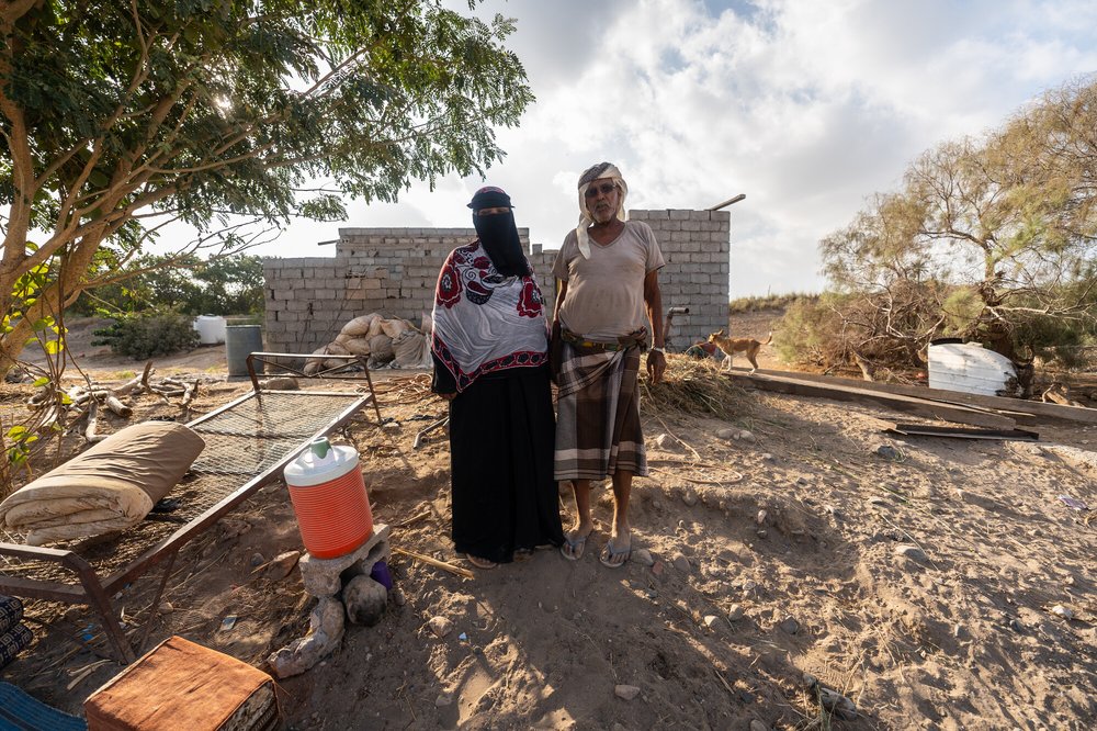 Arwa Ali Nabit, a 50-year-old farmer, and her husband, Hamid Mahmoud Abdullah, stand together in Al-Khaddad area in Lahj Governorate, Yemen.