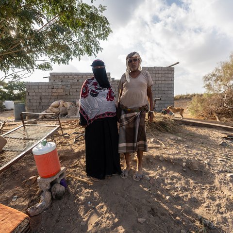 Arwa Ali Nabit, a 50-year-old farmer, and her husband, Hamid Mahmoud Abdullah, stand together in Al-Khaddad area in Lahj Governorate, Yemen.