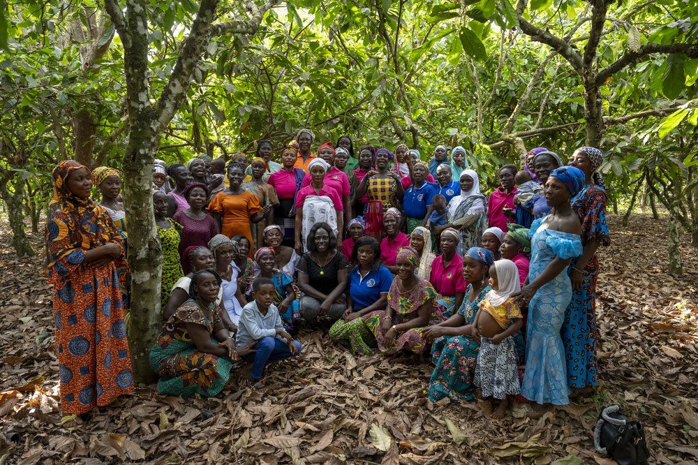 A group of women standing in a forest.