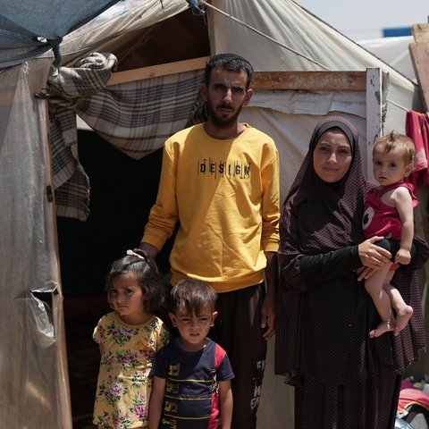 Duaa Abu Sabha is standing in front of her tent in the Al-Mawasi Area in Khan Yunis Governorate, Occupied Palestinian Territory.