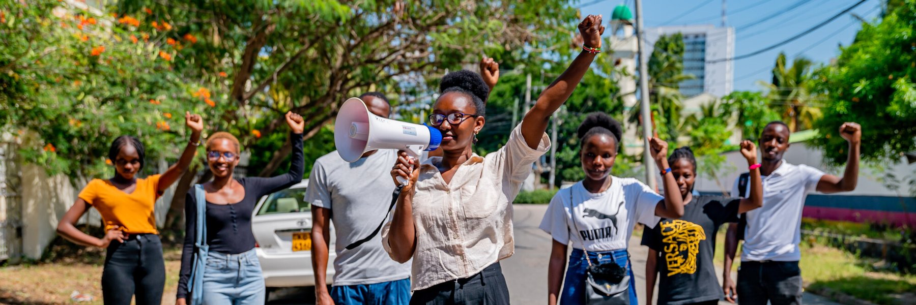 Climate activist Joyce Koech poses with friends and activists in Mombasa County, Kenya.