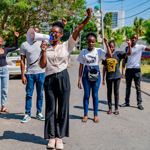 Climate activist Joyce Koech poses with friends and activists in Mombasa County, Kenya.