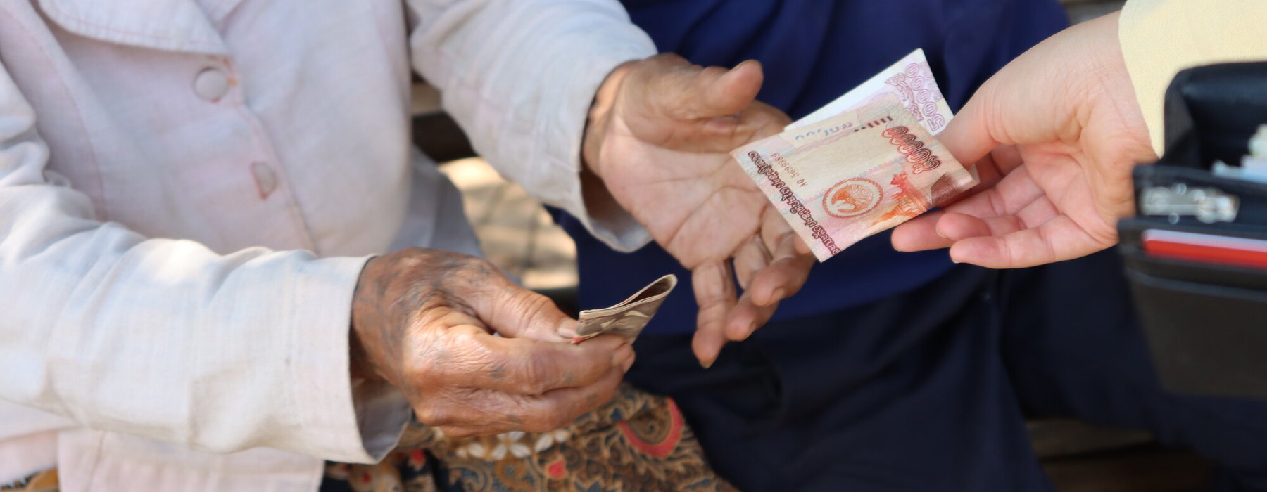 Mrs. Sa in Laos receives an Oxfam cash transfer.