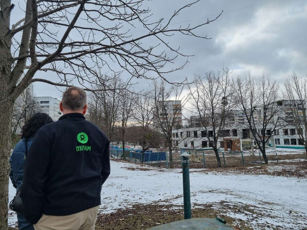 Oxfam staff look at damaged buildings in Kharkiv, Ukraine