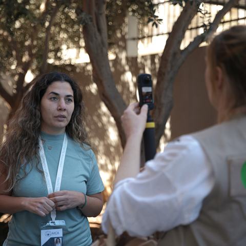 A member of Oxfam staff interviewing staff from Alawite Islamic Charity Association (AICA) in Lebanon.