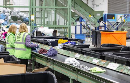 Donated clothes being sorted at Batley warehouse - Oxfam's Northern Logistics Centre.