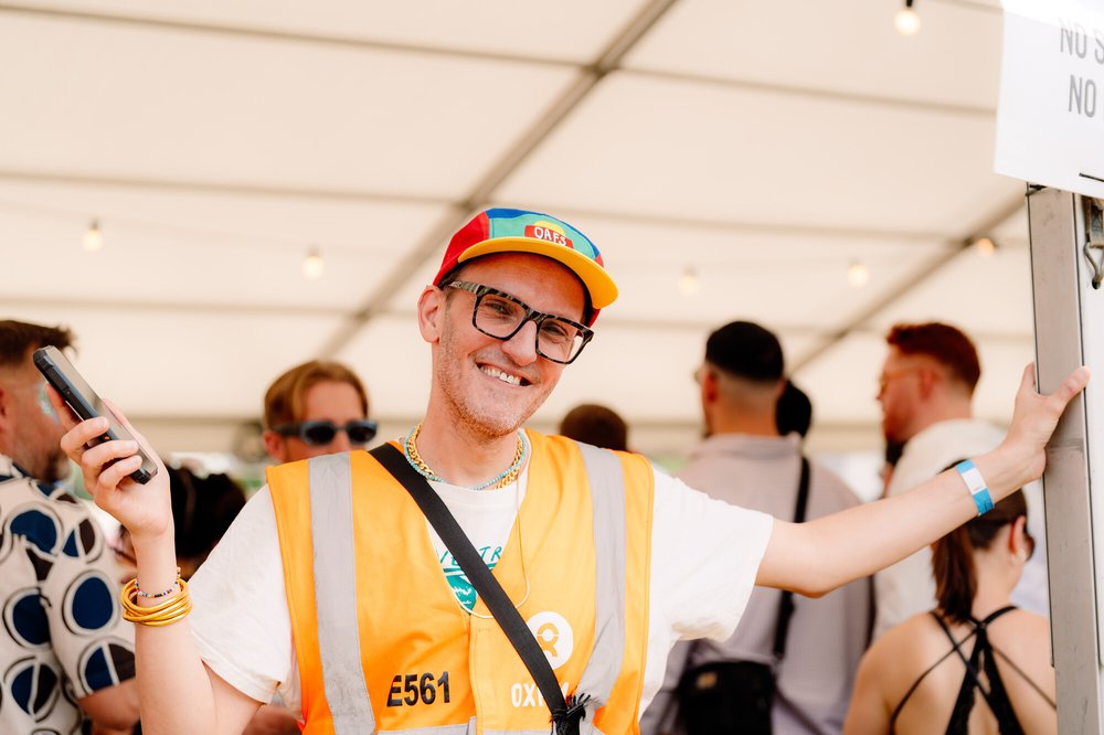 Oxfam steward working on a festival gate