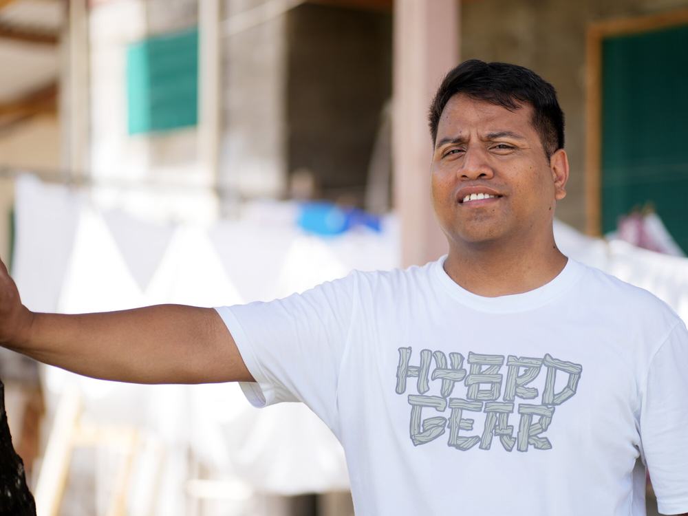a man stood outside, facing the camera.