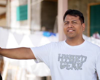 a man stood outside, facing the camera.