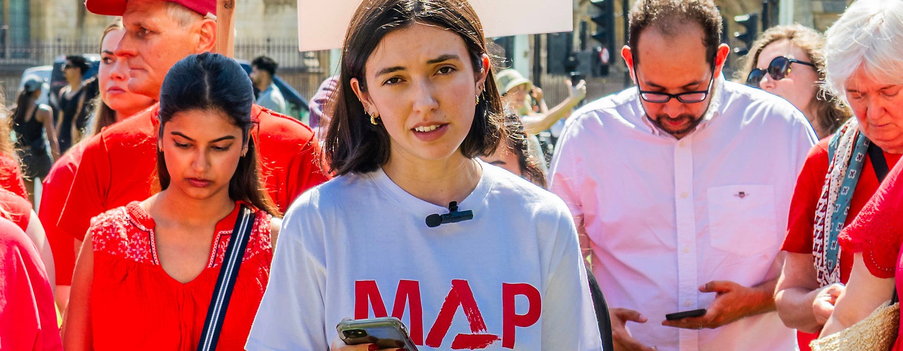 Marnie Lekutanoy from Medical Aid for Palestinians speaks at a protest outside Westminster in July 2025.