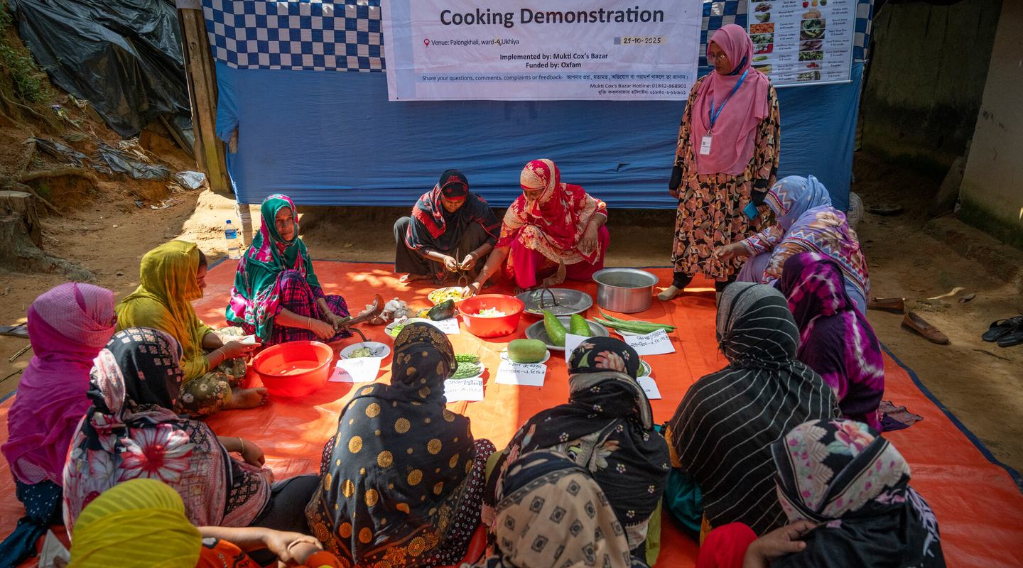 Host community women attend a practical cooking demonstration in Cox's Bazar.