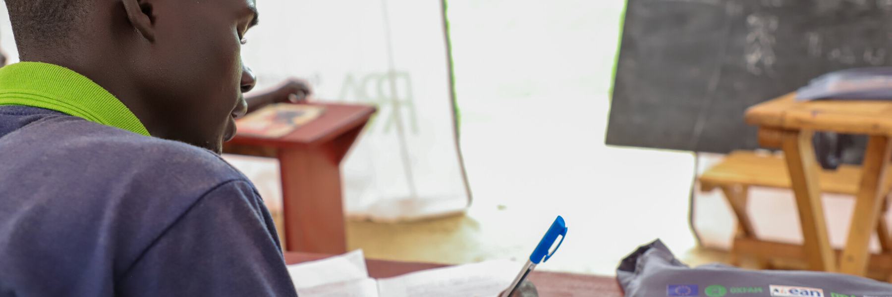 A boy sits in class at Naror Mobile Learning Centre, Uganda.
