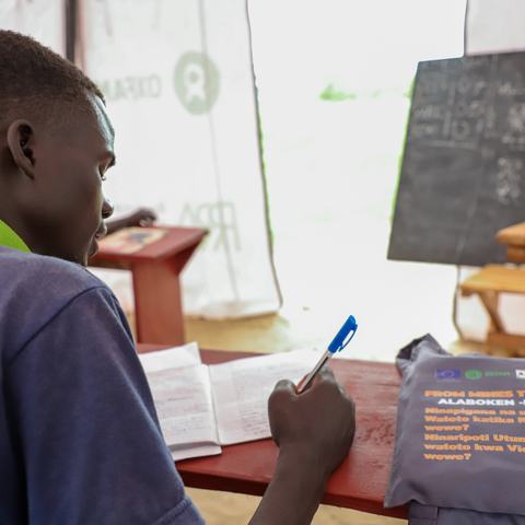 A boy sits in class at Naror Mobile Learning Centre, Uganda.