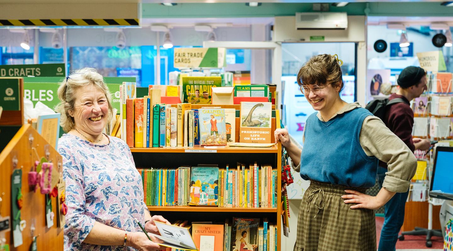 Volunteers Susan and Anna having a friendly chat at Oxfam Shop Bedford Street, Norwich.