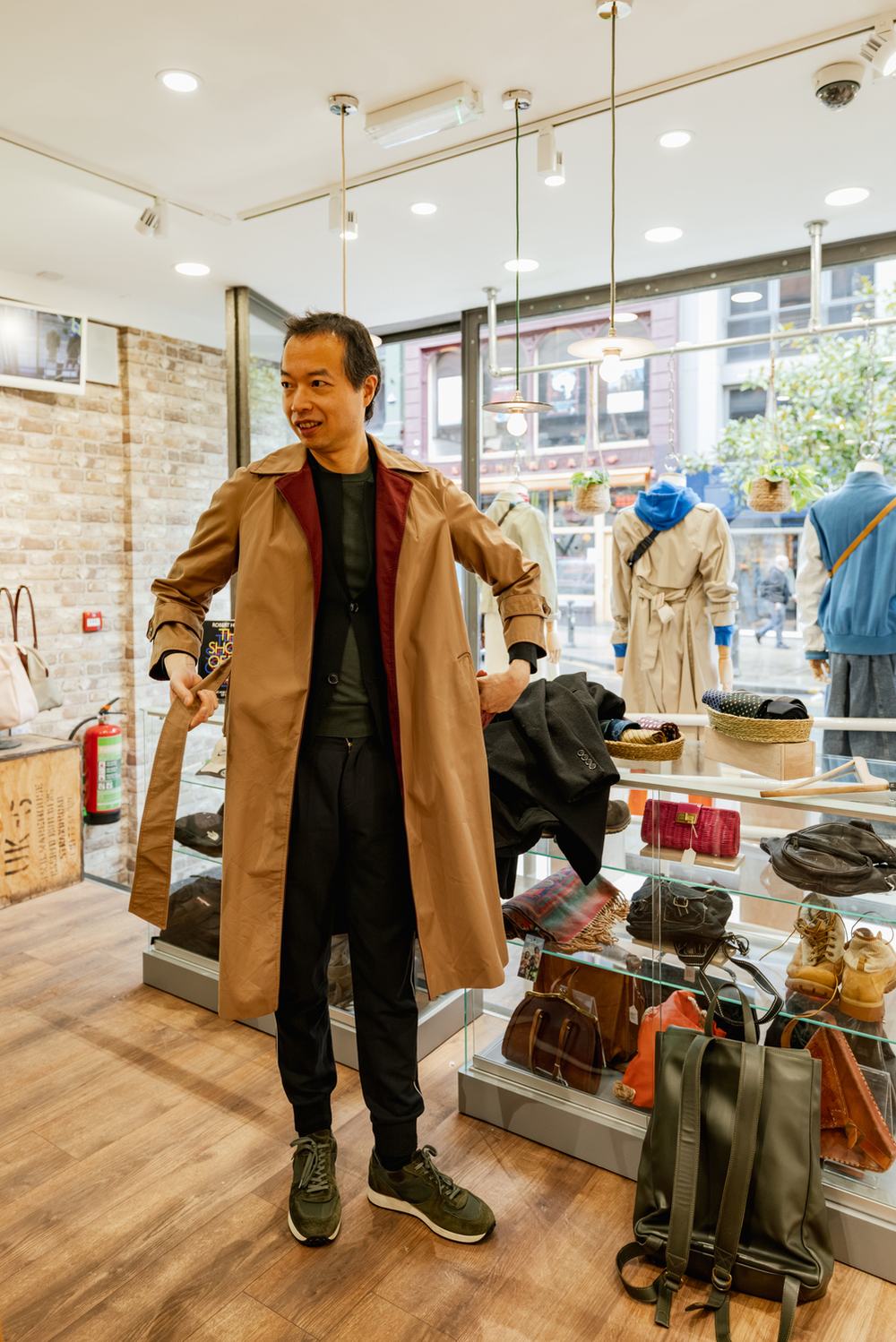 Man wears camel coloured trench coat
