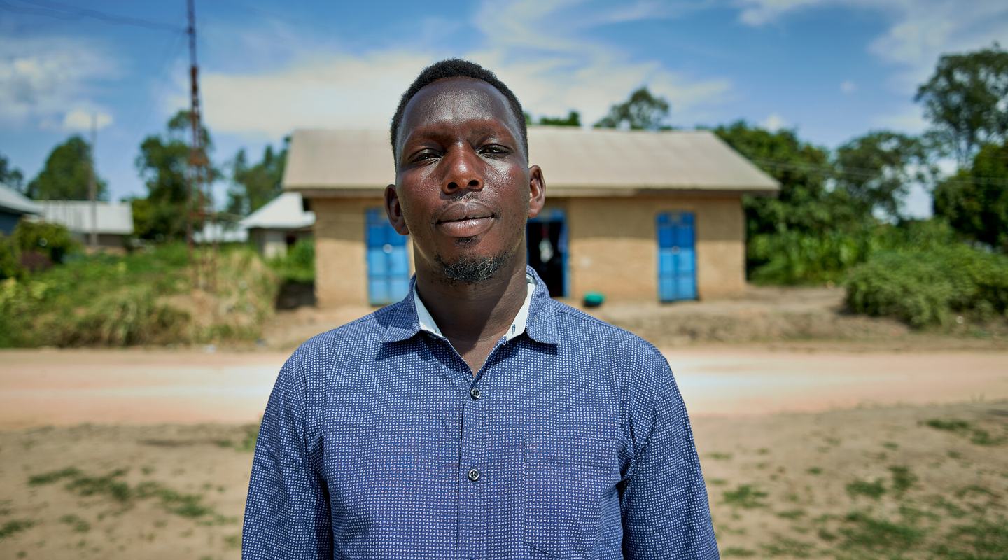 a man is stood outside, facing the camera.