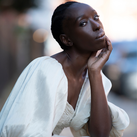 Eunice Olumide wearing a white dress