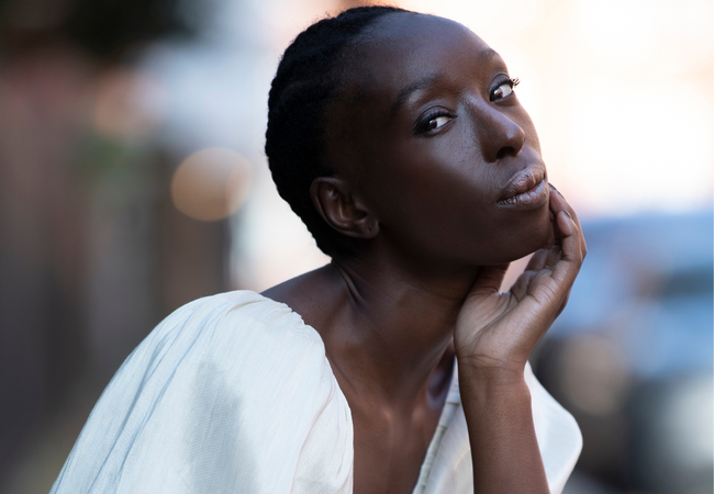 Eunice Olumide wearing a white dress