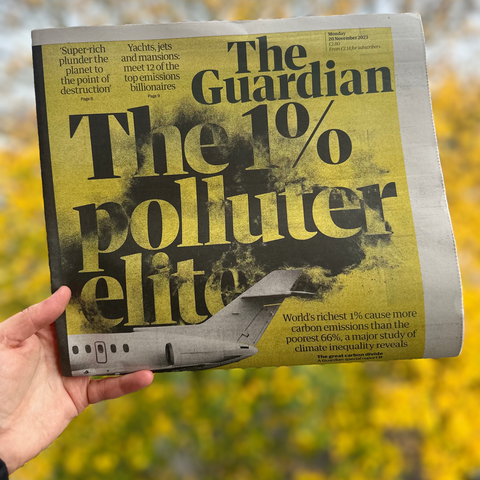 A Guardian newspaper with 'the 1% polluter elite' as a headline an a graphic of a plane.