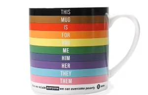 A mug with the Progress Flag stripes on that says 'this mug is for you me him her they them'