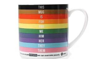 A mug with the Progress Flag stripes on that says 'this mug is for you me him her they them'