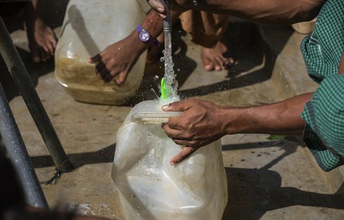 A jerry can being filled with water