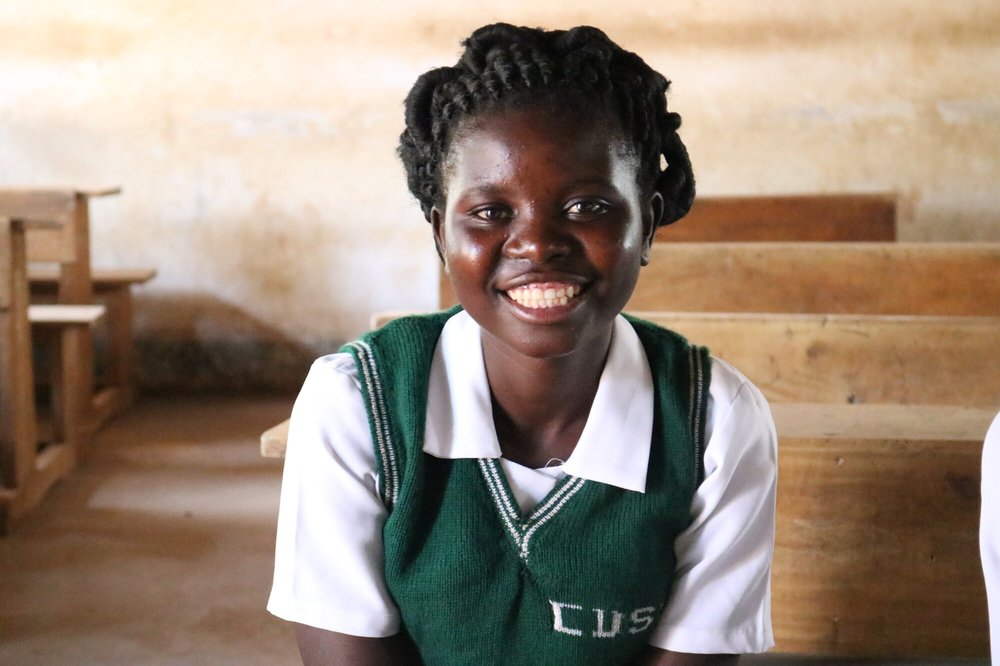 Jessy in one of the classrooms at Chilanga Community Day Secondary School