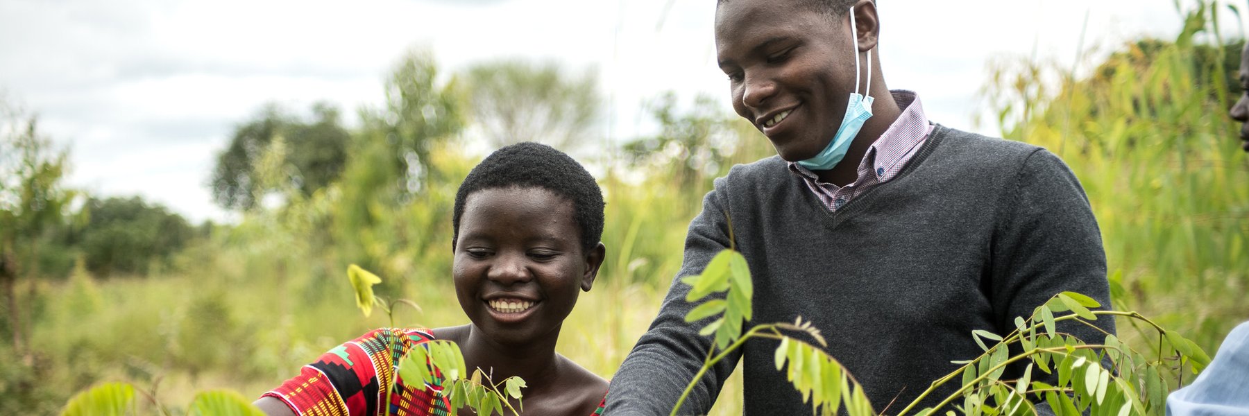 Jessy Nkhoma and Isaac Mzembe arrange tree seedlings