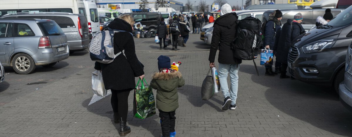 Xenia, Armel and their son Gabriel* 3 at a transit centre in Poland