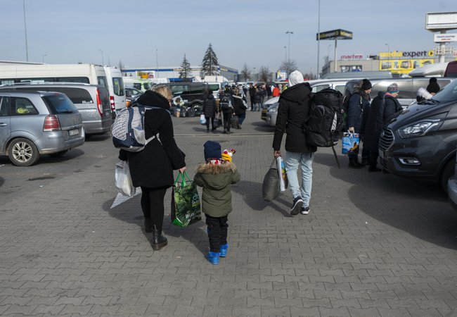 Xenia, Armel and their son Gabriel* 3 at a transit centre in Poland