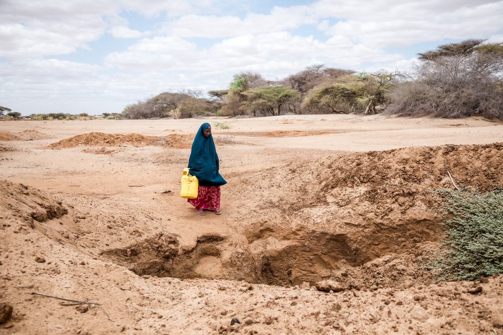 Halima walking to water point in Isiolo County, Kenya.