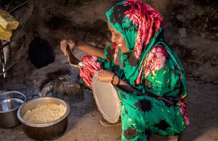 Safia cooking rice and potatoes