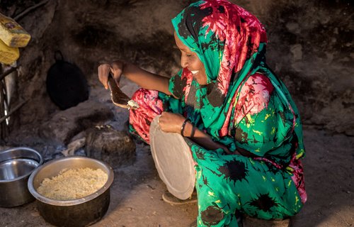 Safia cooking rice and potatoes