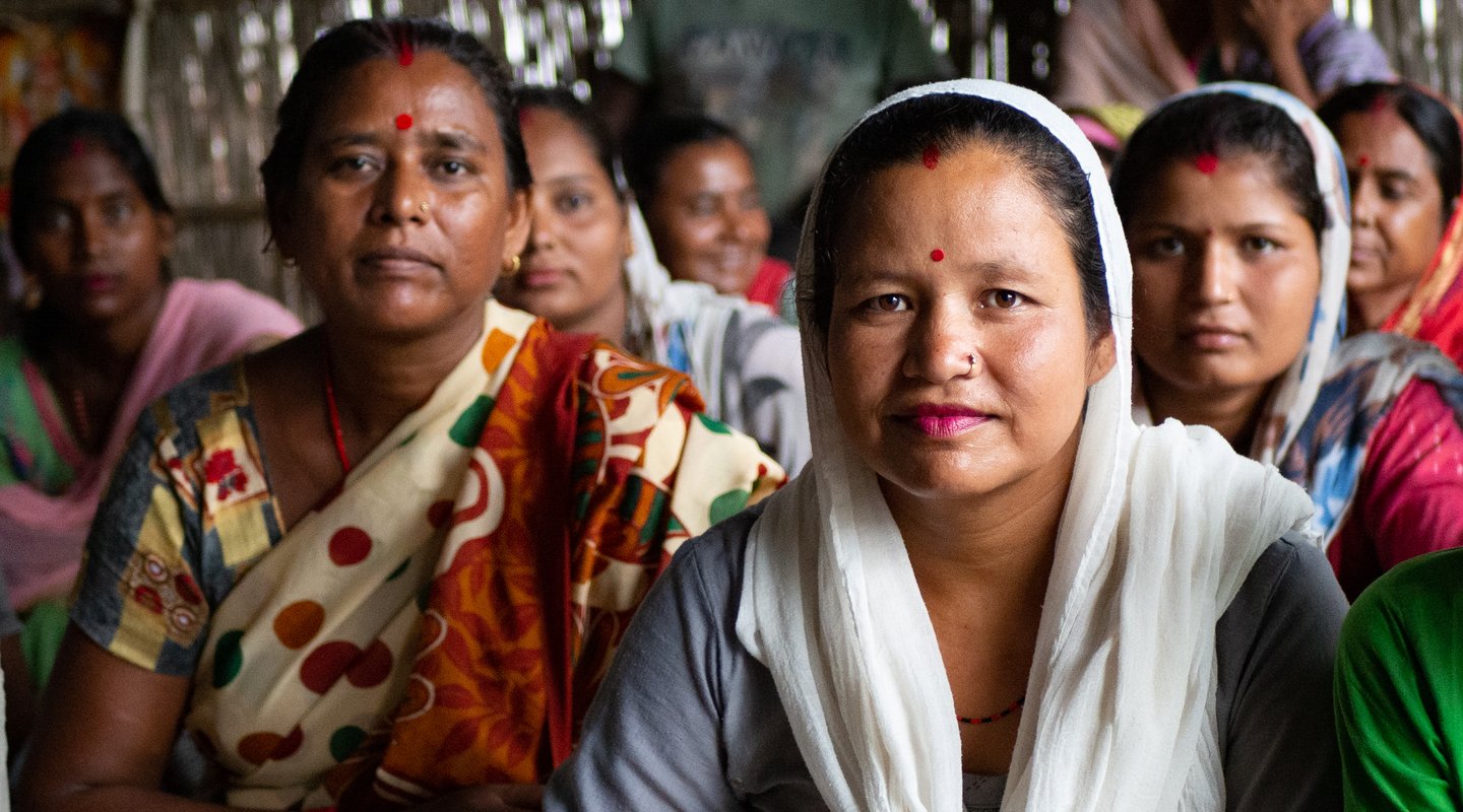 A group of seated women at a women's group in Nepal.