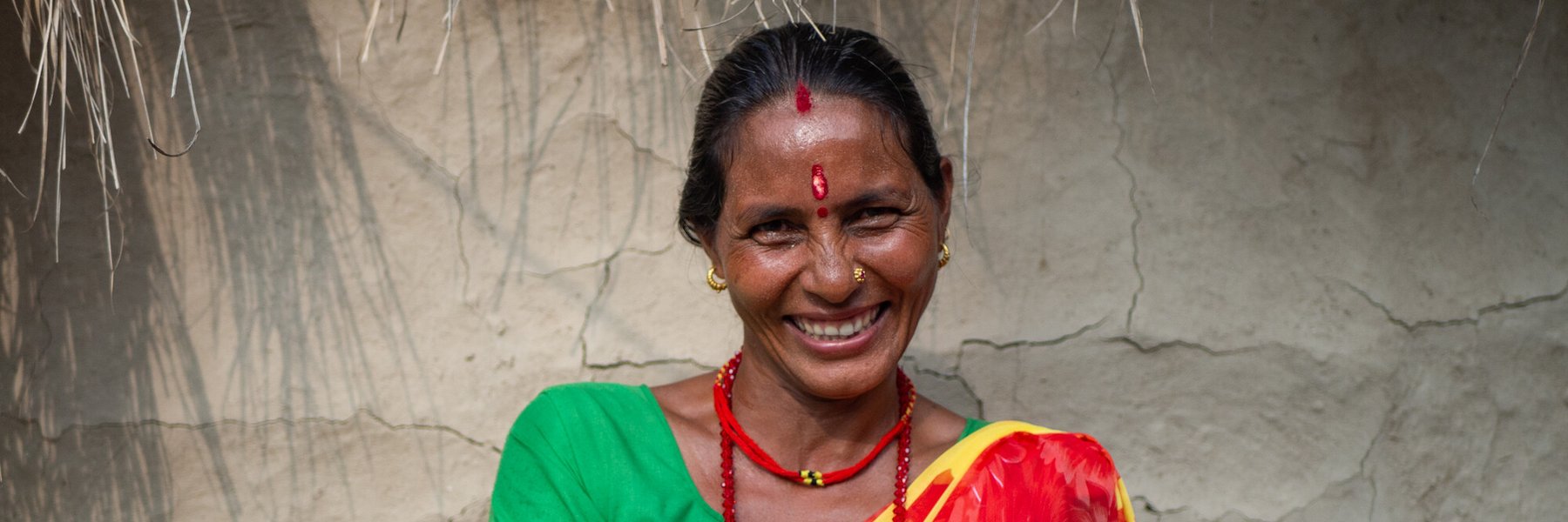 Bimala Devi Bhatta holds garlic grown by members of her community’s women’s group