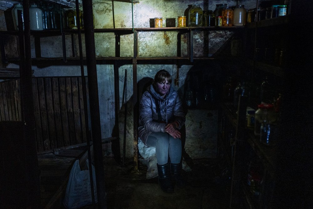 A woman sitting in her shelter