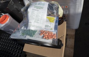 Nuts and other food items in bags inside a box