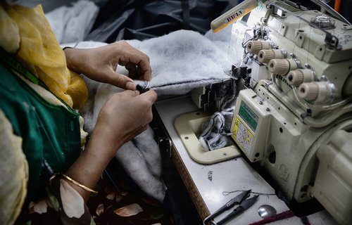 Textile workers are working inside a garment factory in Savar. Bangladesh