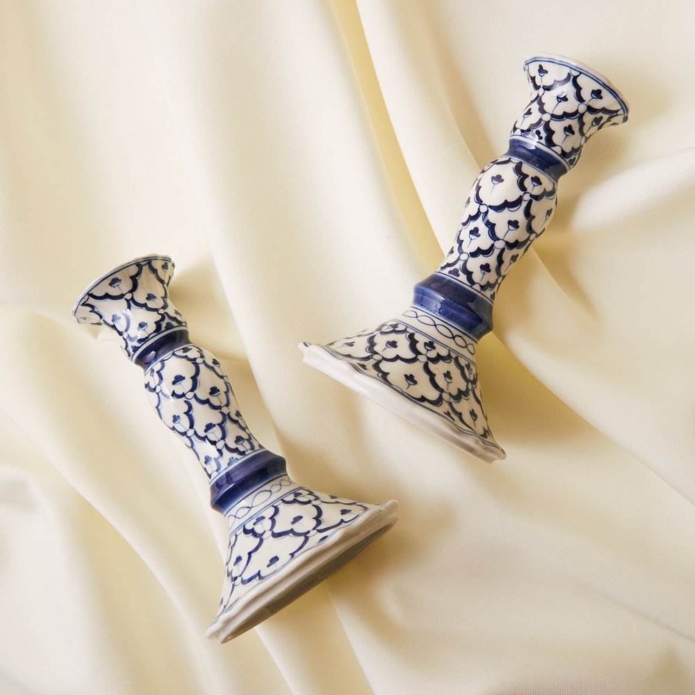 Two decorative blue and white candlesticks