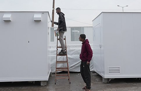 Workers hired by Oxfam in Gaza working on manufacturing six desalination units.