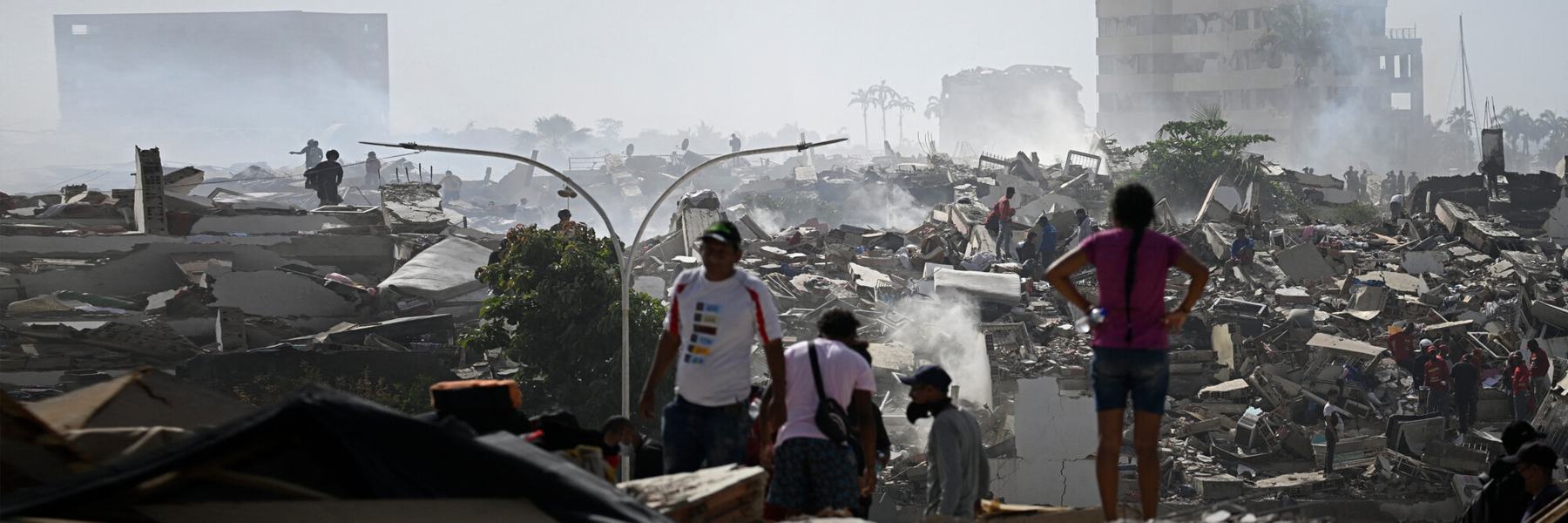 Volunteers search for survivors in a collapsed building following the twin earthquakes in La Guaira state, Venezuela.
