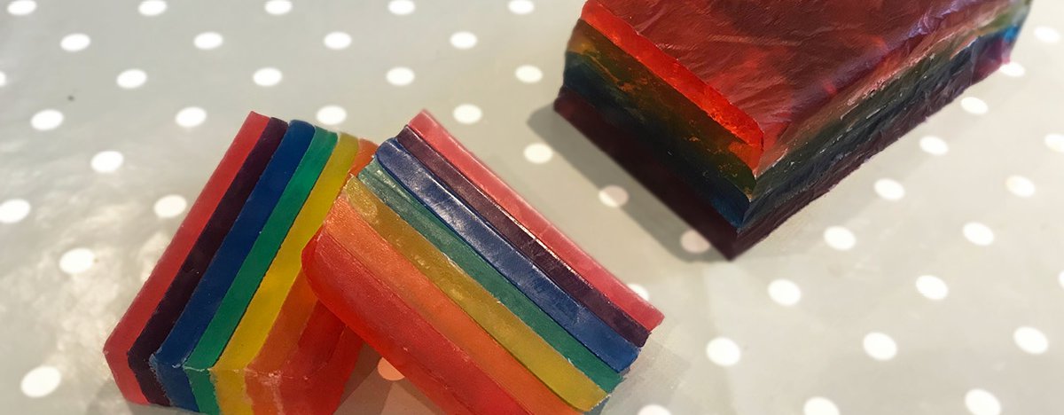 A close-up of rainbow-coloured homemade soap