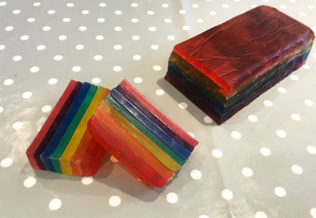 A close-up of rainbow-coloured homemade soap