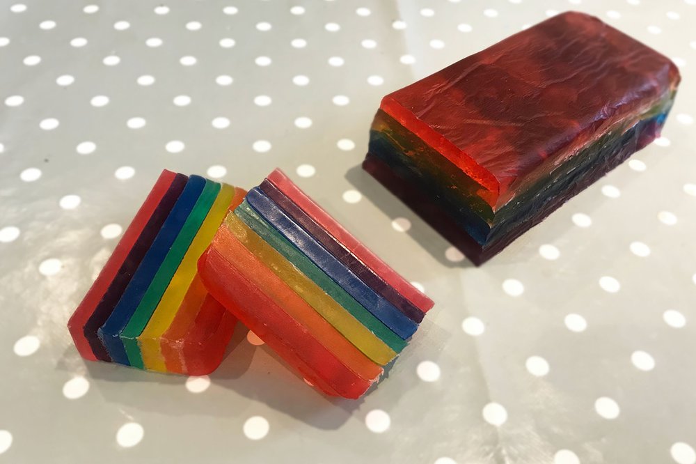 A close-up of rainbow-coloured homemade soap