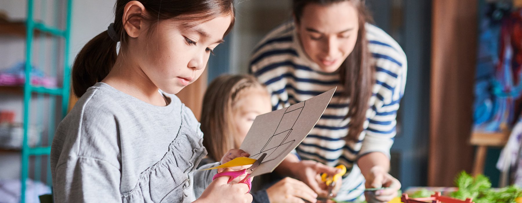 Children cutting decorations for Christmas