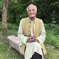 Satish Kumar sitting in the garden