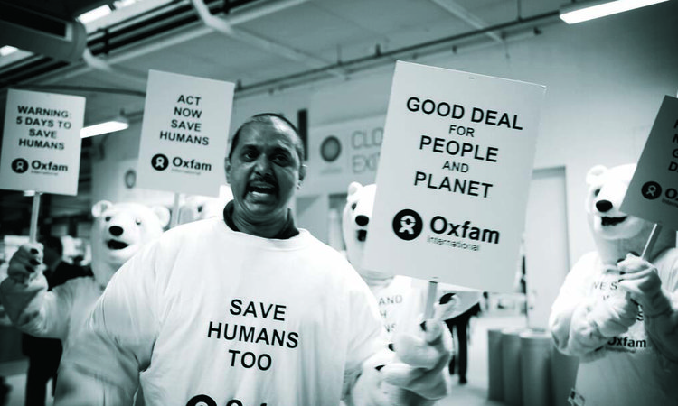 A black and white image of a climate change protestor at a protest